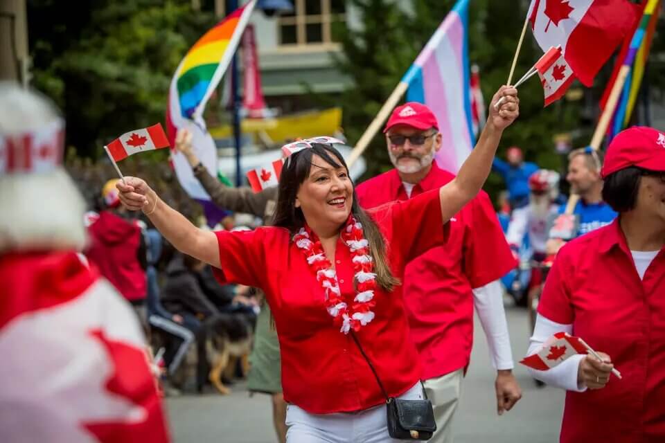 People celebrate Canada Day by participating in a parade