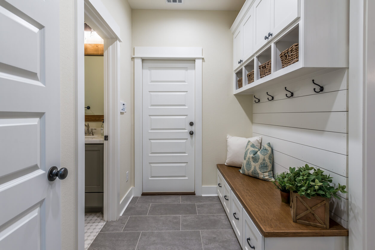 Gorgeous mudroom with storage for a modern narrow lot house